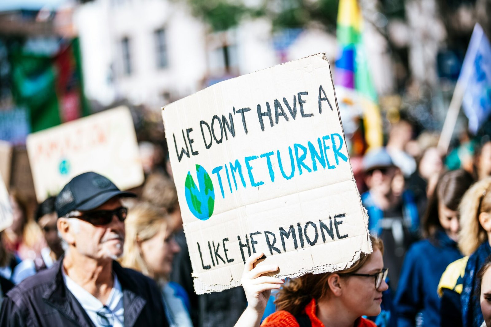 people holding signage during daytime