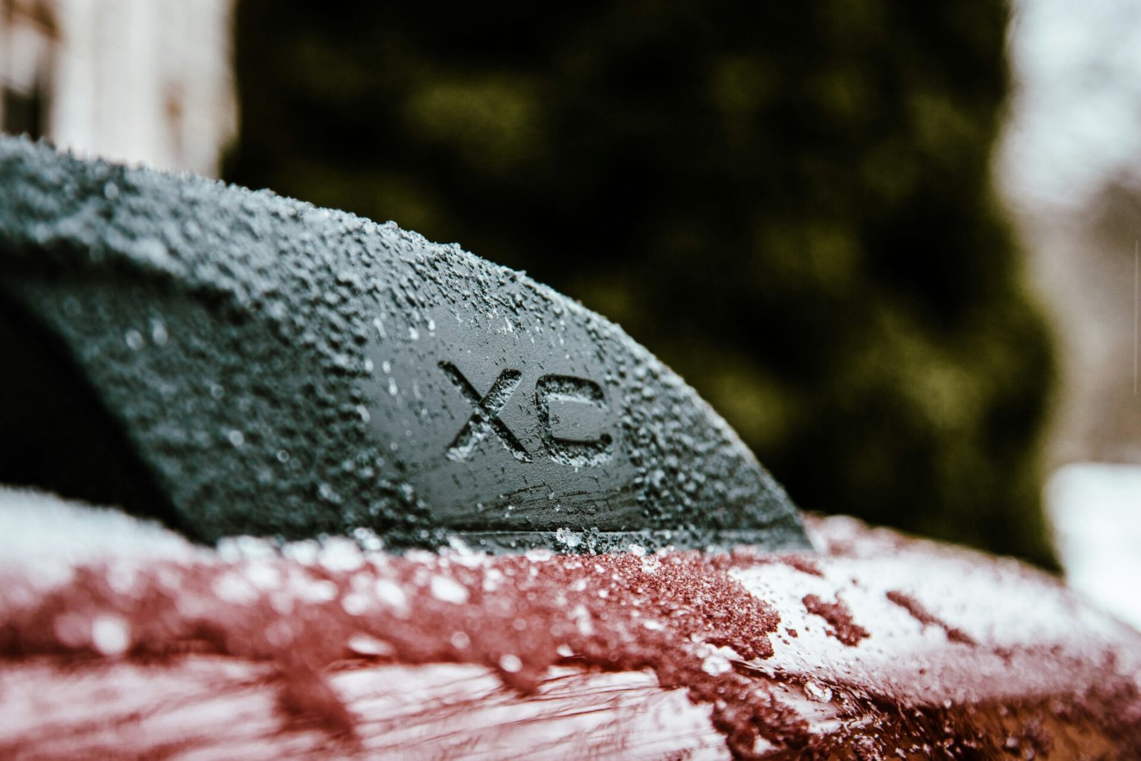 a close up of a car with snow on it