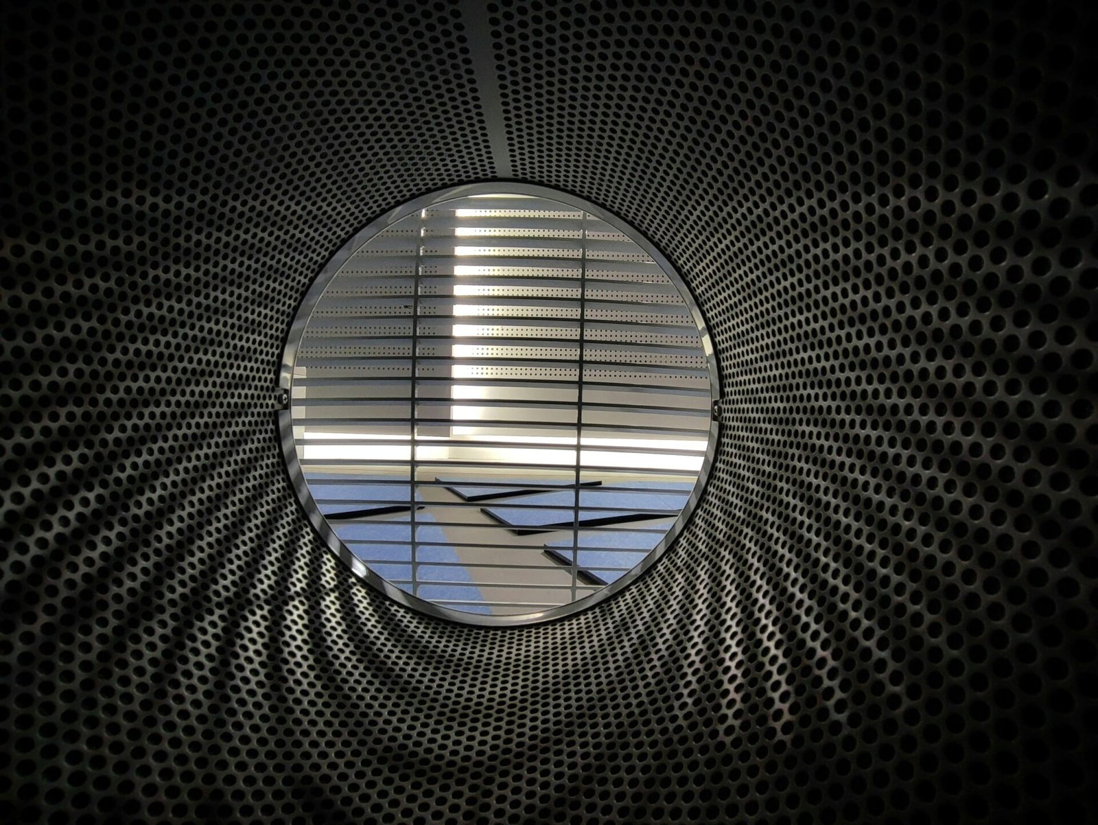 an airplane is seen through a circular window