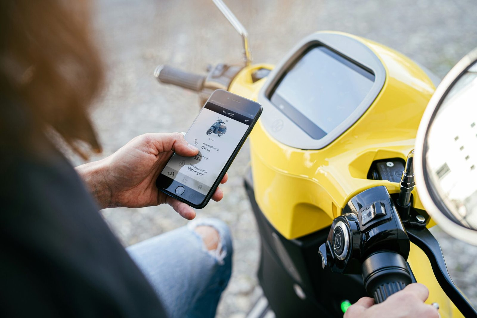 person holding yellow and black digital device